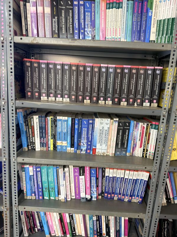 Reference books on library shelves
